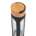 A glass bottle with a white background