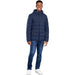 Man wearing a blue padded jacket